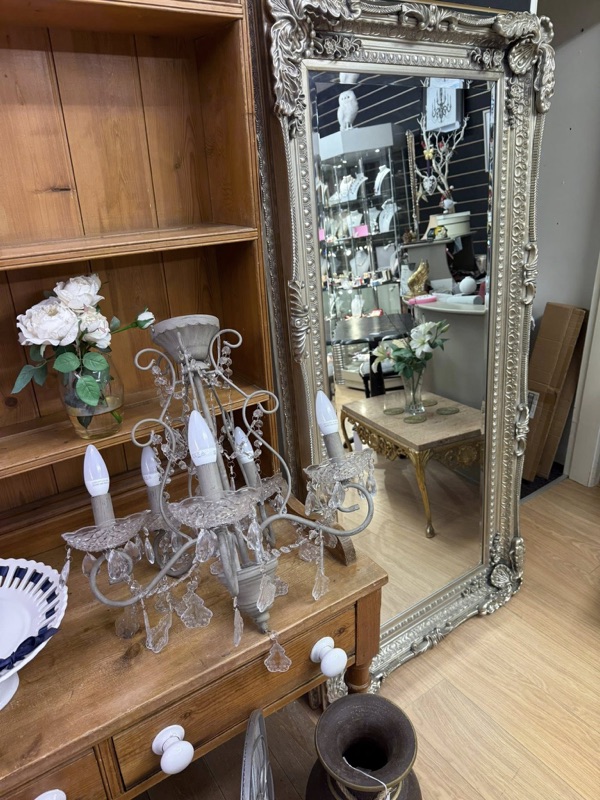 Vintage Crystal Chandelier and Ornate Silver Mirror